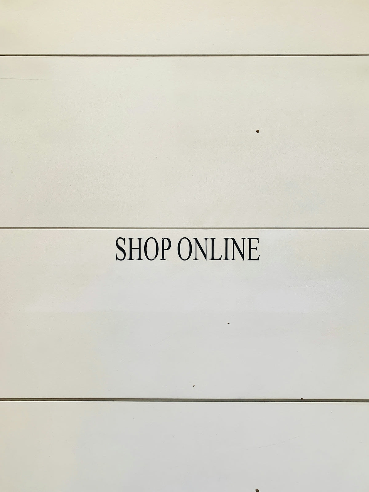 black text labeled Shop Online
