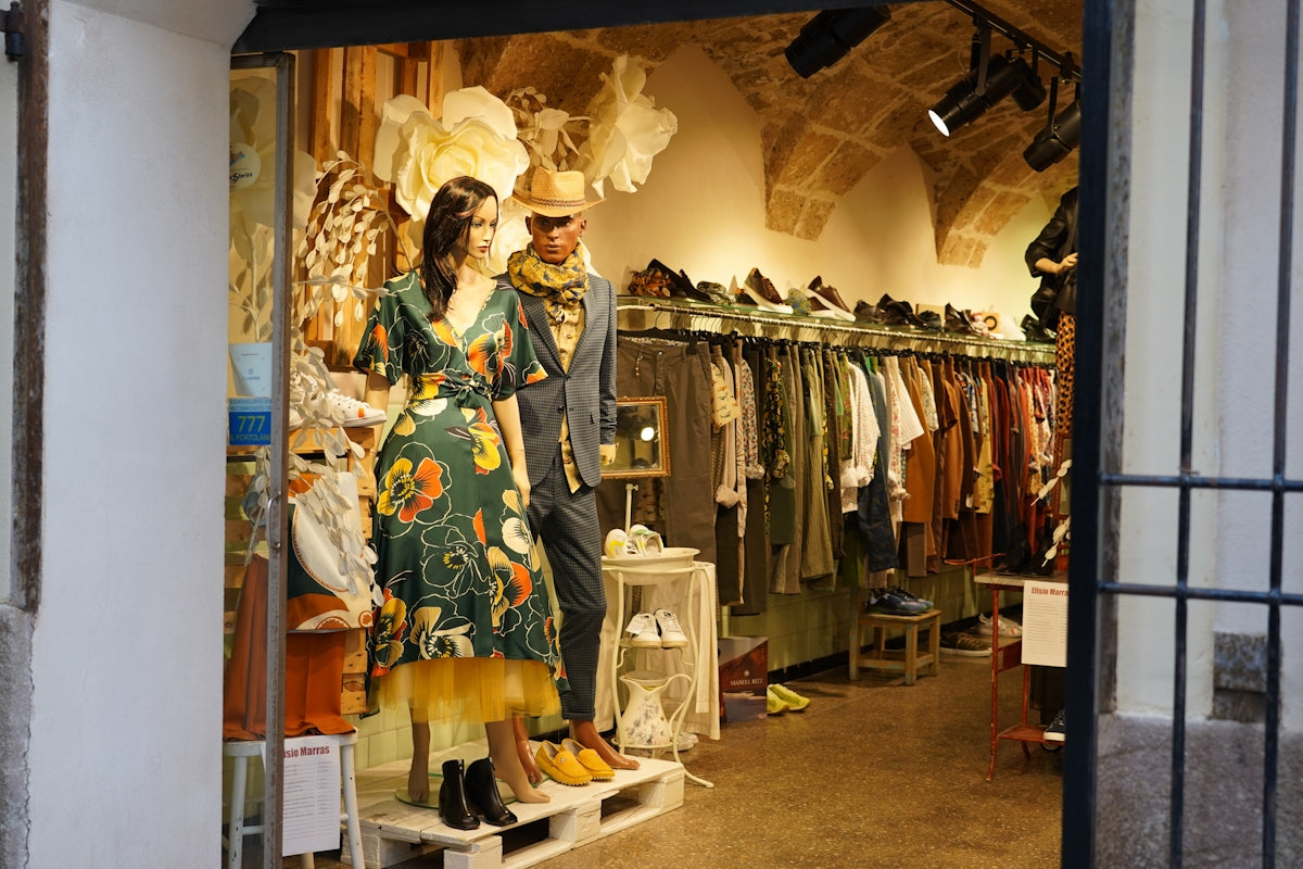 a man and woman in a clothing store