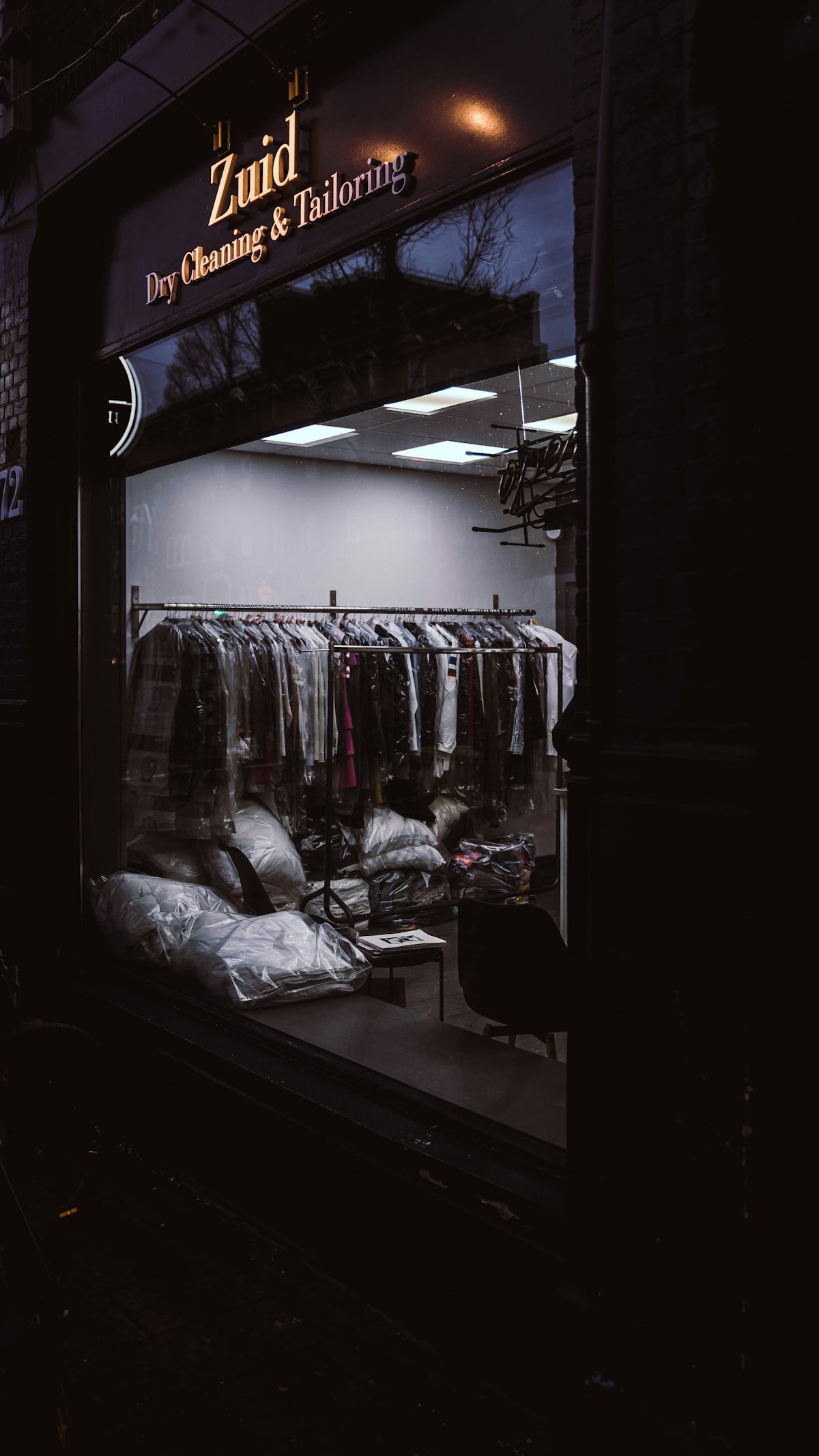 a clothing store window with clothes in it