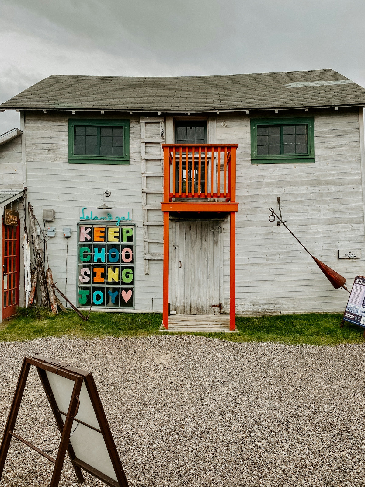 a white building with a sign that says keep school going today