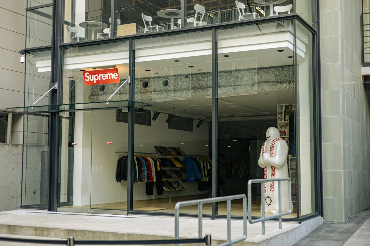 a store front with a sign that says supreme