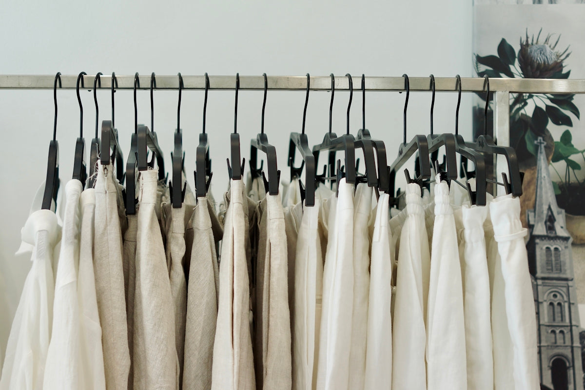 a rack of clothes hanging on a rail