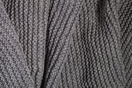 A close up of a sweater with a pattern on it