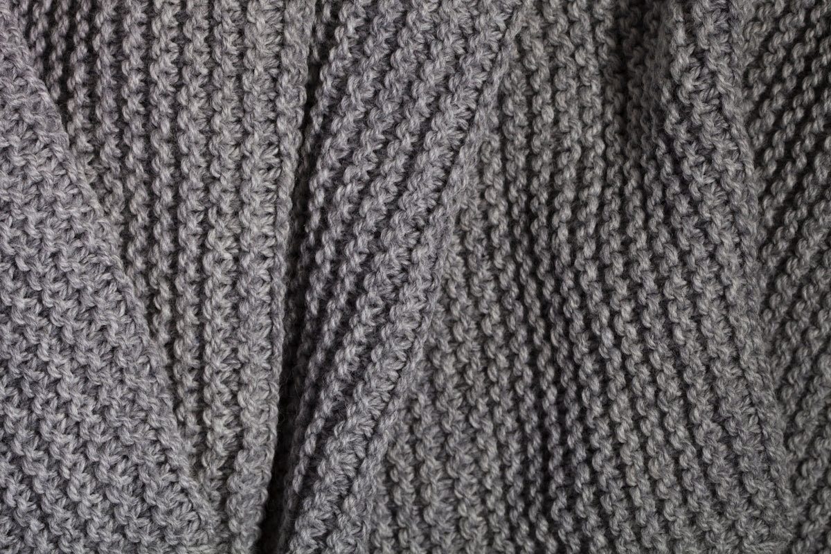 A close up of a sweater with a pattern on it