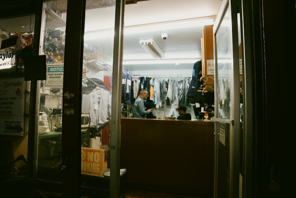 A store front at night with the lights on